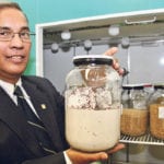 Digvir Jayas, vice president of research at the University of Manitoba and a grain storage expert, shows off a jar of flour loaded with red flour beetles. Jayas recently introduced some new science surrounding computer vision and teaching computers how to recognize insects within grain bins. | Robert Arnason photo