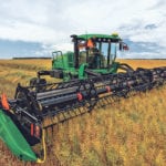 The W170 fits within Deere’s windrower lineup below the biggest, but with enough swather power for heavy crops and hilly terrain. | John Deere Photo