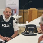 Saskatchewan RCMP commanding officer Curtis Zablocki listens to rural municipal concerns at a Saskatchewan Association of Rural Municipalities meeting in Kipling, Sask., earlier this month. | Karen Briere photo