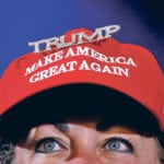 A woman wears a Make America Great Again cap as U.S. President Donald Trump speaks during a rally in Great Falls, Montana, July 5. Trump’s hard line on trade has sparked retaliatory actions from many of the United States’ trading partners. | REUTERS/Joshua Roberts photo