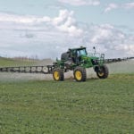 A farmer was spraying his crop last week near Viscount, Sask. Recent rain has helped the crop over much of the Prairies, although dry regions remain. | Robin Booker photo