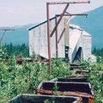 The remains of the head frame and processing plant sit at the old Nordegg coal mine. These coal cars would have hauled thousands of tons of coal from the mine to the processing plant over the years. | Duane McCartney photo