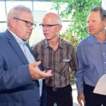 Federal Agriculture Minister Lawrence MacAulay, left, talks with Garth Patterson and Keith Degenhardt of the Western Grain Research Foundation July 12 about a new research cluster focused on agronomy. | William DeKay photo