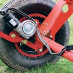 The drive system on Kramble Industries’ remote-controlled electric drive system retrofit for straight grain augers has a motor mounted on each drive wheel. | Robin Booker photo