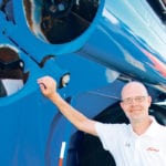 The new Demco 22-series grain carts feature a 22-inch diameter unload auger that empties the 1,330 bushel cart in less than two minutes. Auger height adjusts from 11-feet, eight-inches up to 15-feet, seven-inches. Demco rep Benji Vande Griend says prices on the new line will be available in November. | Ron Lyseng photo