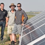 Daniel Visser of Western Solar, left, helped three southern Alberta farming operations set up a 300 kW solar system to operate irrigation pivots. Among the farming partners are Ron Lamb, centre, and Ben Fankhauser. The irrigation system draws water from nearby Clear Lake. | Barb Glen photo