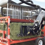 A bale is loaded into the Maximizer. Inventor Emil Gulbranson of Vanderhoof, B.C., says it costs about $3 per bale to dry it down to acceptable levels, plus the cost of loader and operator. | Barb Glen photo
