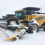 Combines covered in snow sit on Jerome Isaac’s farm near Debolt, Alta., after a recent snow. | Jerome Isaac photo