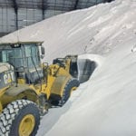 Urea fertilizer is loaded and dumped into a transfer hopper at the Southwest Terminal near Gull Lake, Sask. | William DeKay photo