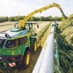 Sensors keep the chop unload on-target for the box, as the system moves through the crop. At nearly 1,000 h.p., the new Deere forage harvesters not only appear different on the outside, they have the option of more power and new features. | Chris McCullough photo