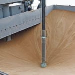 Workers watch a terminal unload of Canadian wheat at Chiba Kyodo Silo Co. in Chiba, east of Tokyo, Japan. | REUTERS/Thomas Peter photo