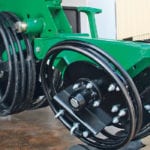 The RFM Auspoint coils on display at Big Iron had seeded 8,000 acres in tough Australian conditions before being shipped to North America, according to PolyTech rep Pat Reinhard. These spring steel coil wheels are flexible to throw off mud and crop residue. The Australian-built coils are used both as closing wheels and also gauge wheels. |
Ron Lyseng photo