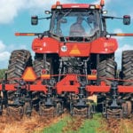 Strip-till tools keep soil disruption to rows where crop will be planted. This demonstration at COFS was well attended. | Michael Raine photo