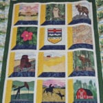 Members of the Bergen Ladies Aid pieced this quilt, which they donated to Mountainview County in central Alberta. The work is hand stitched and depicts different aspects of the county. The group was formed 110 years ago, and members continue to quilt and support charities with their folk art. | Barbara Duckworth photo