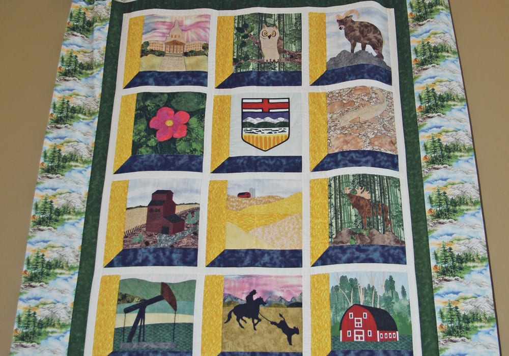 Members of the Bergen Ladies Aid pieced this quilt, which they donated to Mountainview County in central Alberta. The work is hand stitched and depicts different aspects of the county. The group was formed 110 years ago, and members continue to quilt and support charities with their folk art.  |  Barbara Duckworth photo