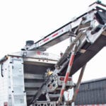 The upgraded Agrilite conveyor unloads 4,000 pounds per minute and has a side swing of 10 feet both left and right. | Ron Lyseng photo