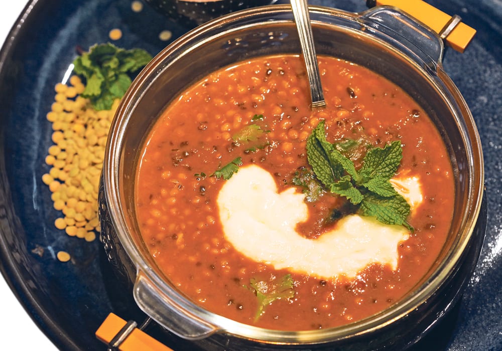Dal, a traditional thick vegetarian spiced stew, is served with yogurt and mint with rice or flatbread. It’s typically made with red lentils.  |  Michael Raine photo