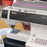 This mechanical sewing machine uses buttons and dials to select the stitch type, width and length. The sewing table opens to store accessories and is removable to convert the machine to an open arm for use in setting in sleeves and mending pant legs. | Betty Ann Deobald photo