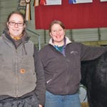 Sarah Eigner, left, and her sister, Lani Barnett, are enthusiastic promoters of the Salers breed. Their family farm is near Thorhild, Alta., and every year they travel to Farmfair International in Edmonton to show and raise awareness. | Barbara Duckworth photo