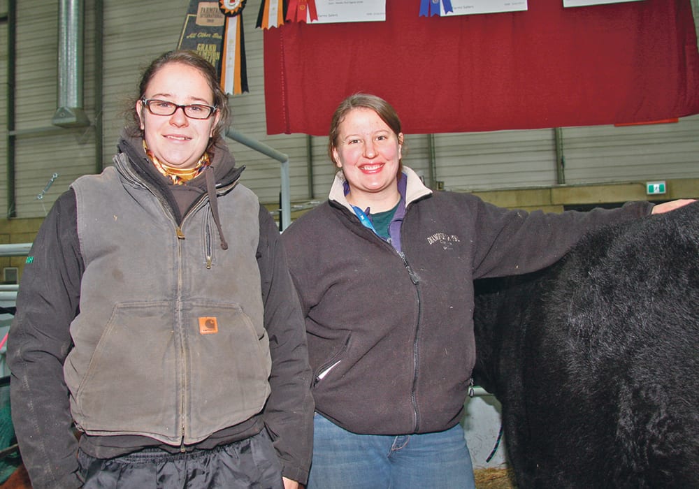 Sarah Eigner, left, and her sister, Lani Barnett, are enthusiastic promoters of the Salers breed. Their family farm is near Thorhild, Alta., and every year they travel to Farmfair International in Edmonton to show and raise awareness.  |  Barbara Duckworth photo