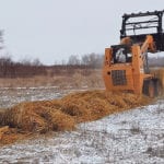 Cameron Nykoliation relies on his skid steer unit for a wide variety of farm activities, including feeding. | C. Nykoliation photo