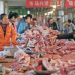 Shutting down small hog operations in China and moving production to large corporate farms could result in a herd reduction that is the equivalent of almost the entire herd in the United States, This would drastically affect supply in the Asian country and in markets such as this one in Beijing. | REUTERS/Jason Lee photo