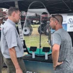 Tom Wolf gets a look at the Simon Innovations Accu-Volume system. | Jason Deveau photo