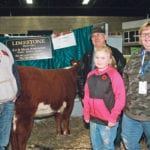 Garth, left, Art, Brittany and Marie Andruchow attended Farmfair International earlier this month to show cattle and be recognized for 50 years with the Hereford breed. | Barbara Duckworth photo
