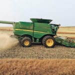 Josh Lade drives his John Deere S680 combine with the Seed Terminator installed near Osler, Sask. | Josh Lade photo