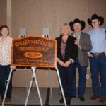 The Radau Family of Coulee Crest Farms with the 2019 Environmental Stewardship Award sign: son-in-law Evan Carr, left, daughter Miranda Carr, Sandra and Randy Radau and Luke Radau and his girlfriend, Jessica Giles. | Les Dunford photo
