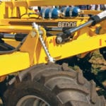 The tractor pressurizes the closed-circuit hydralics on the Terraland and then the operator closes the valve. After that, the twin accumulators, shown in blue, handle all hydraulics. | Ron Lyseng photo