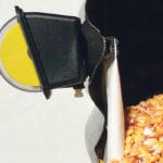 The LevAlert is a simple low-tech non-electronic way of monitoring grain levels while keeping both feet solidly on the ground. Grain pushes against the white canvas tongue on the inside wall. This in turn forces a rod to rotate the bright yellow indicator on the outside wall. | LevAlert photo