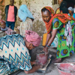 Mulusew Kebede, left, helps build a stove as part of a self-help group that the Mennonite Central Committee supported in Ethiopia.   | Canadian Foodgrains Bank/Stephanie McDonald photo