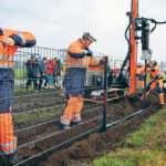 Workers set up a wild boar fence along the Danish-German border last month in an attempt to keep African swine fever out of Denmark. | Ritzau Scanpix/Frank Cilius photo