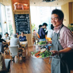 Canadian pork steak makes its way to a customer at HyLife Pork Table, a pork themed restaurant in Tokyo, Japan, operated by Manitoba’s HyLife, pork producers and processors. The restaurant opened in 2016. | REUTERS/Issei Kato photo