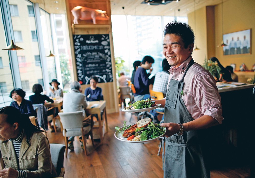 Canadian pork steak makes its way to a customer at HyLife Pork Table, a pork themed restaurant in Tokyo, Japan, operated by Manitoba’s HyLife, pork producers and processors. The restaurant opened in 2016.  |  REUTERS/Issei Kato photo