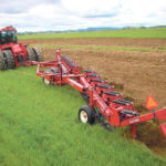 Set properly, modern moldboard plows, like this Salford 8212, can have a place in some prairie agriculture. One of the functions is the machine’s ability to move soil up a grade, reforming topsoil on knolls. In this case it is plowing under a rye cover crop. | Salford photo