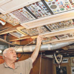 Les Ferris has amassed a collection of hundreds of curling pins from the Brier and world curling championships. He mounts a portion of the collection on the ceiling of his basement. | Robert Arnason photo