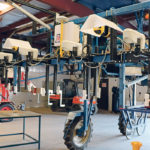 This mobile sensor platform built by agricultural engineers at the University of Arizona uses a host of sensors on its front boom to monitor crop plots. | Robin Booker photo