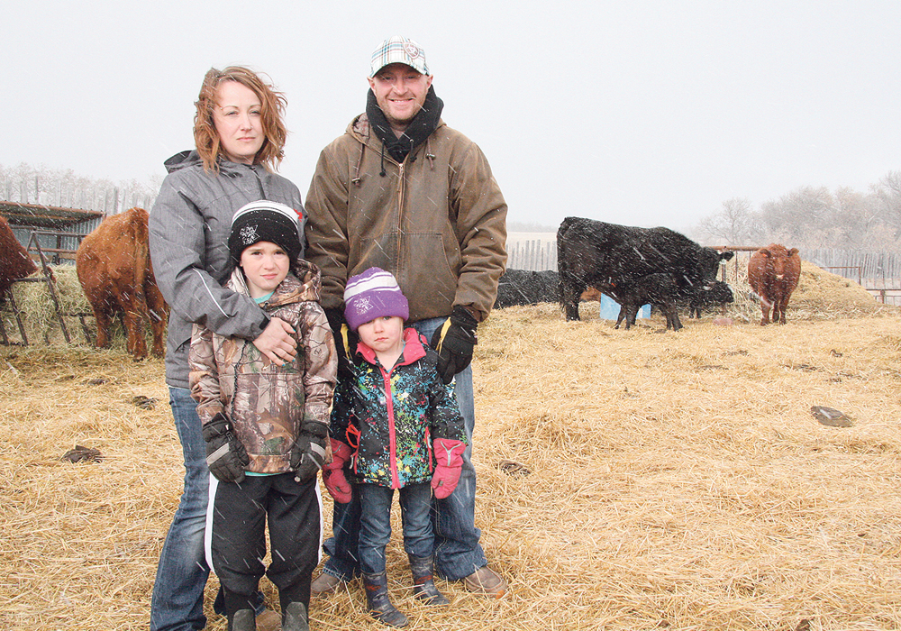 Ashley and Ryan Kattler, with son Flint and daughter Summer, farm south of Indian Head, Sask. | Karen Briere photo