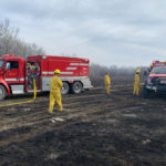 Members of the Delisle and District Volunteer Fire Department (DDVFD) prepare for redeployment after putting out some hot spots east of Duperow Road, southwest of Biggar, Sask. on the morning of Tuesday April 23. The DDVFD has members in satellite departments in both Pike Lake and the R.M. of Montrose. Members from all three halls responded to a call for mutual aid from the Biggar Fire Department that was received at 4:45 a.m. April 23. | Paul Yanko photo