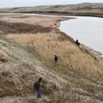 Participants in an April 26 tour of the Milk River region explored the mouth of the so-called irrigation “Spite Ditch” developed in the early 1900s. | Barb Glen photo