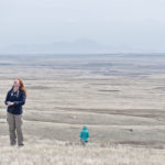 Kendra Forbes, education and outreach coordinator with the Milk River Watershed Council, listens for the call of a nearby Sprague’s pipit, one of Alberta’s endangered bird species, during a recent tour of the Milk River Watershed. | Barb Glen photo