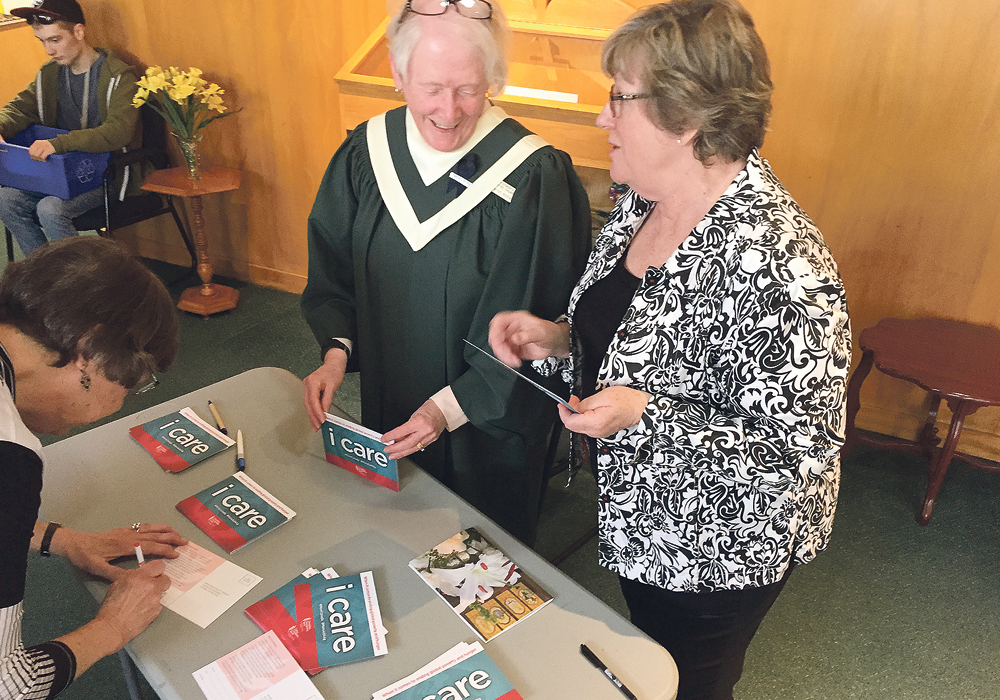 Supporting the Canadian Foodgrains Bank isn’t restricted to farm country. At this Winnipeg church, volunteers collect signatures calling on the government to increase its support.  |  Ed White photo