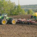 Shares of Deere, known for its trademark green tractors and harvesting combines, fell as much as 6% to $137.18, as slump in demand for big agricultural machines has forced the company to cut production by 20 percent at two of its large factories in North America. | File photo
