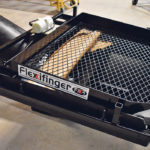 The Vibra-Screen has a main deck of one-inch expanded steel welded to its frame. Farmers have a choice between a half inch and three-quarter inch screen that is fitted above the main deck. The variable-speed 115-volt vibrating motor keeps the product flowing while shaking it into the correct granular shape. | Dave Dietrich photo