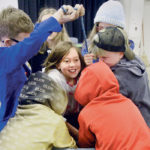 Using a barrel full of canola and a rope tied to a round piece of wood, students learn first hand the herculean strength needed to pull out someone engulfed in grain. “It takes almost 850 pounds to pull an average person’s body out, who is engulfed in grain. That’s almost impossible,” said Keith Markwick, who ran the grain safety booth. | William DeKay photo