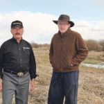 Peter Onofreychuk and his son, Mark, on their farmland near MacNutt, Sask. The Blackbird Creek has at times flooded surrounding land due to agricultural drainage upstream. | Karen Briere photo