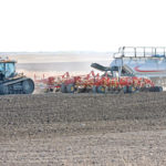 A grower near Insinger, Saskatchewan kicks up dust while seeding in the middle of May. | Robin Booker photo