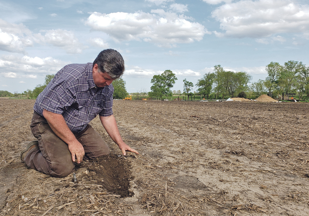 Farmer Dave Walton takes a look at one of his drier, but still damp Wilton, Iowa soybean fields last week. The trade dispute with China means his crop might not reach Chinese ports as it once could have and will be replaced there by Brazilian beans.  |  REUTERS/Kia Johnson photo